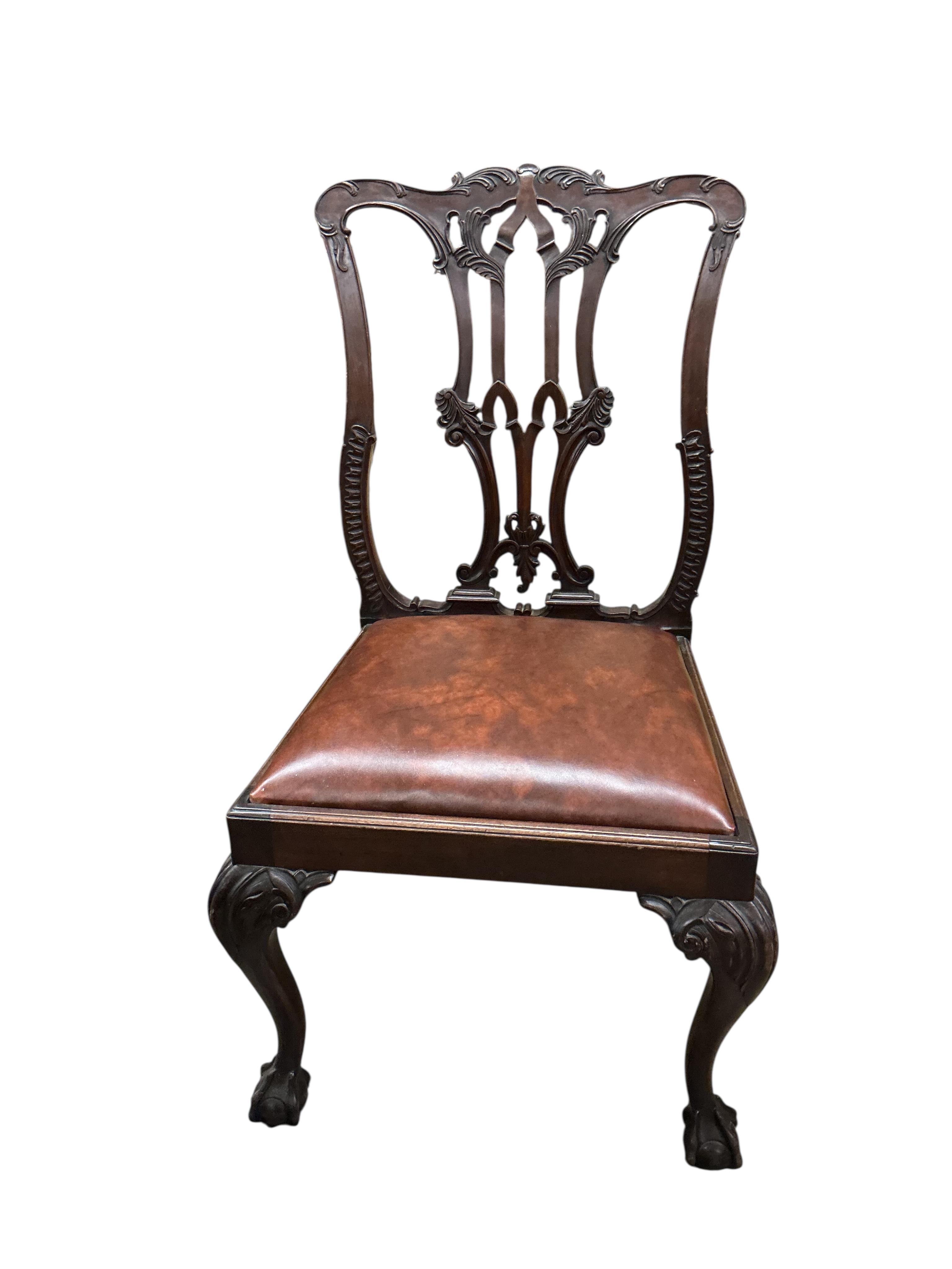A set of six Chippendale Revival mahogany dining chairs, two with arms